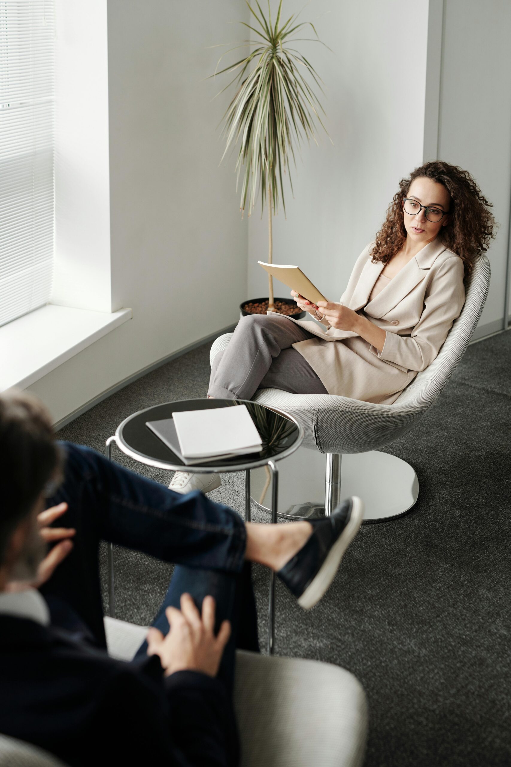 Image of therapist conducing individual therapy to patient in therapist office.