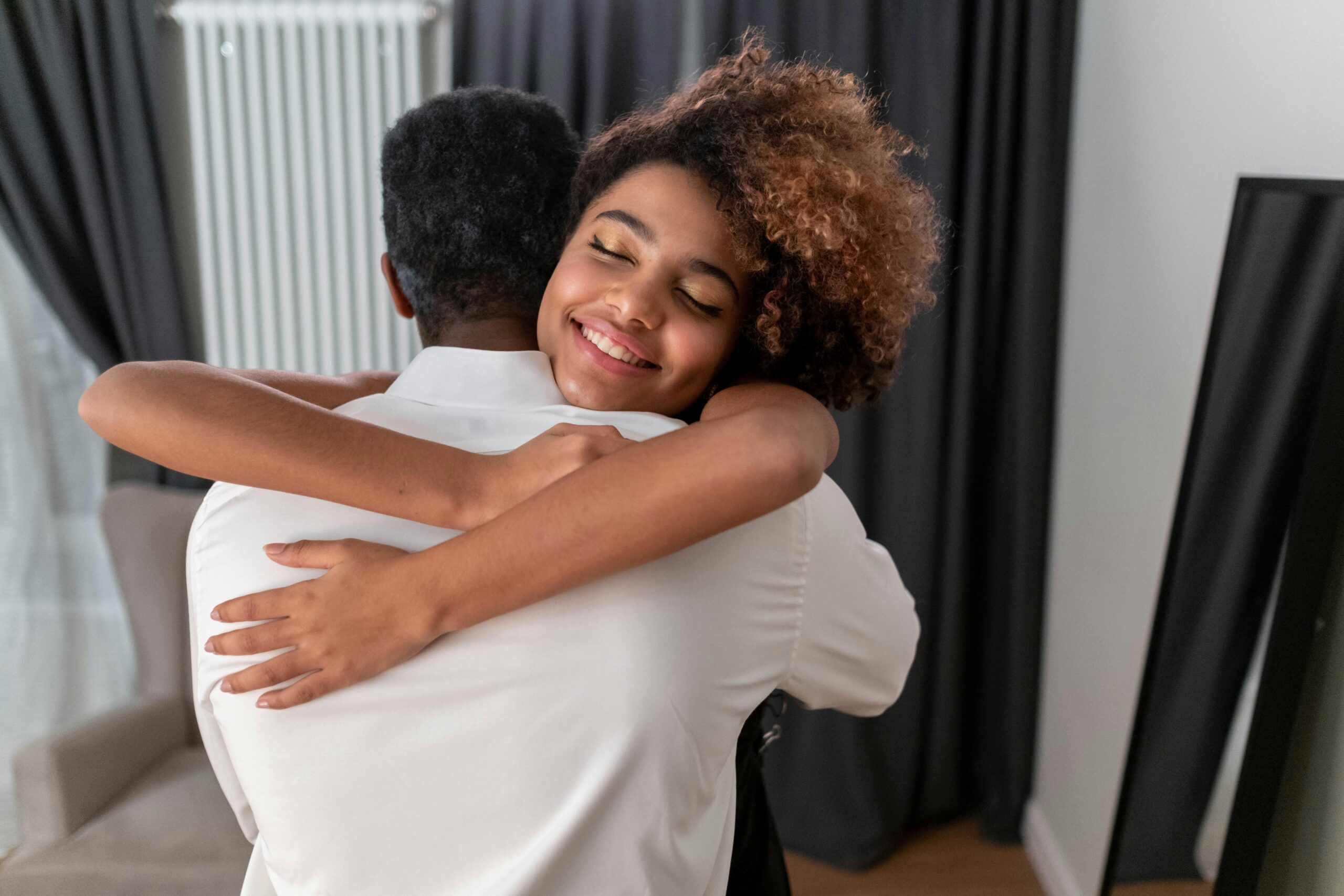 Image of two partners hugging each other.