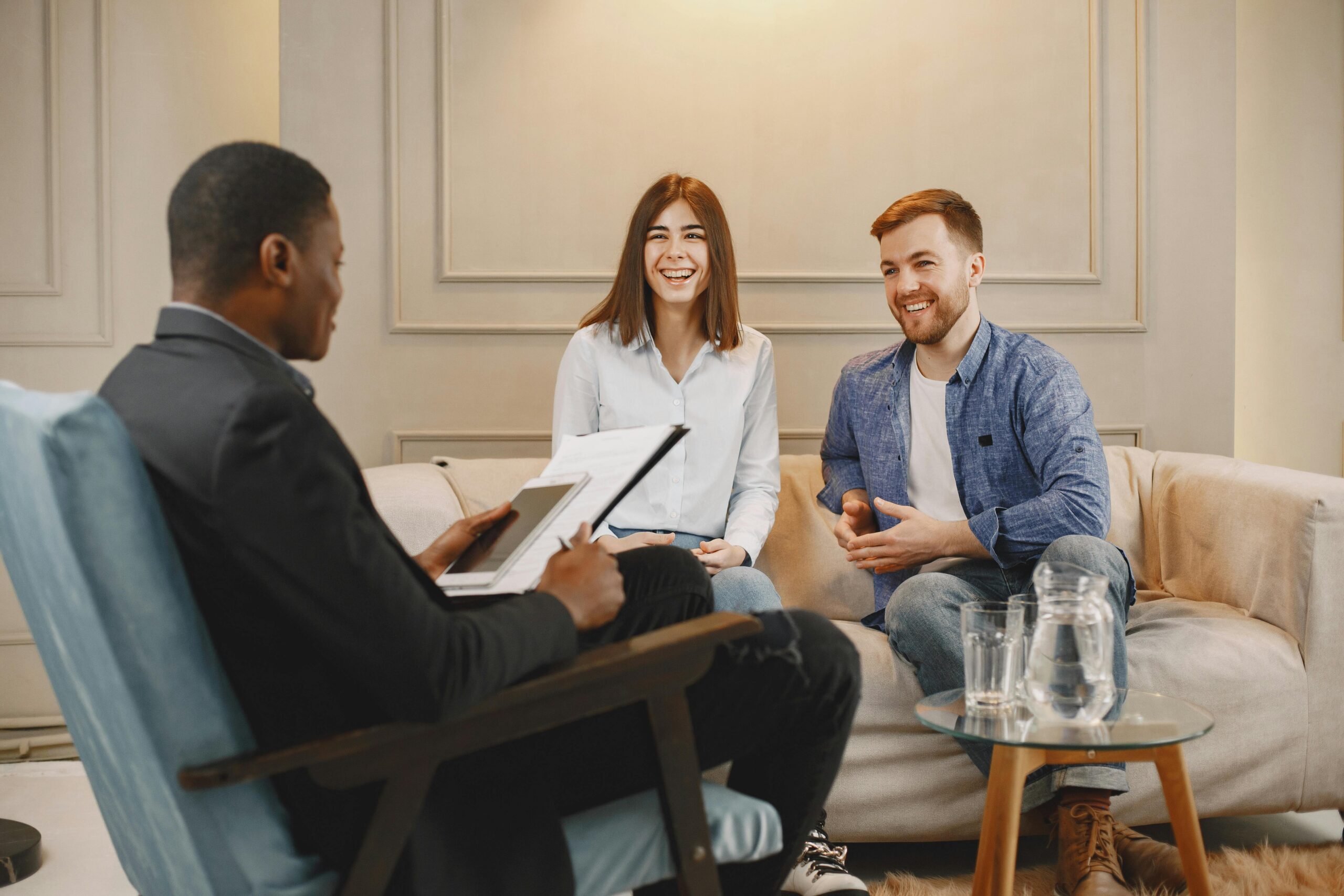 Image of couple with therapist in office conducting couples therapy.