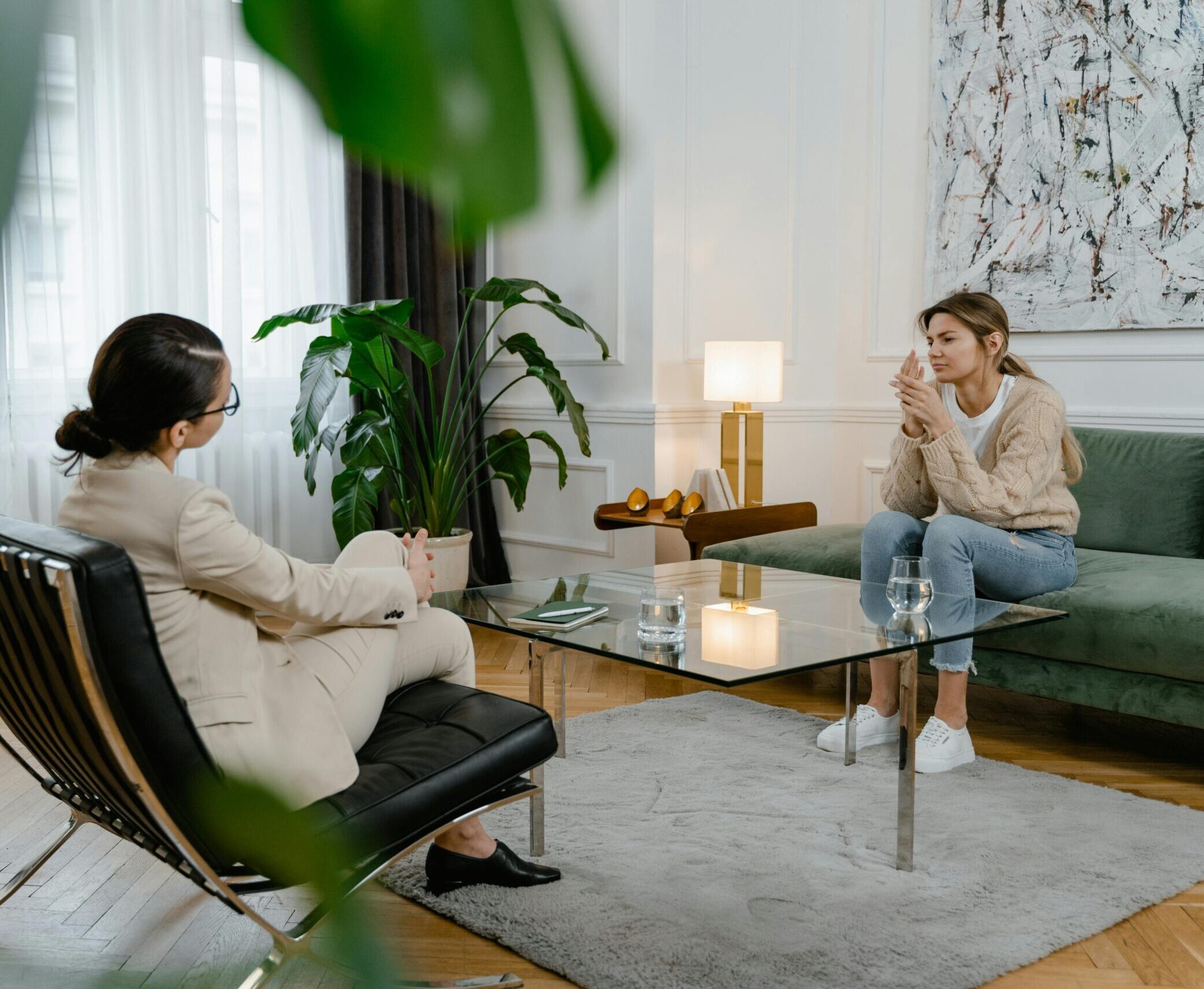 Image of patient and therapist sitting in therapist office doing therapy.