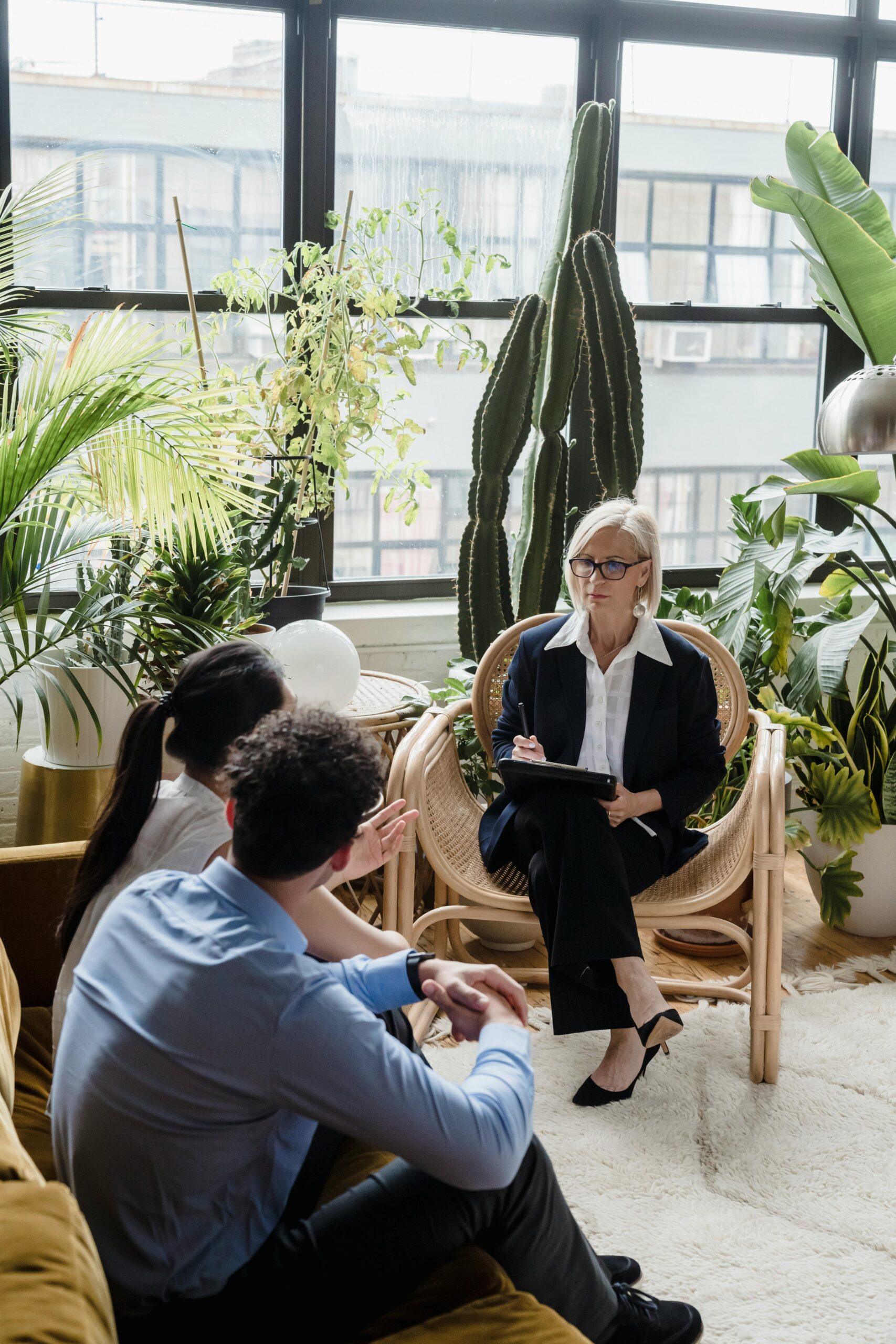 Image of couple with therapist in office doing couple's therapy.