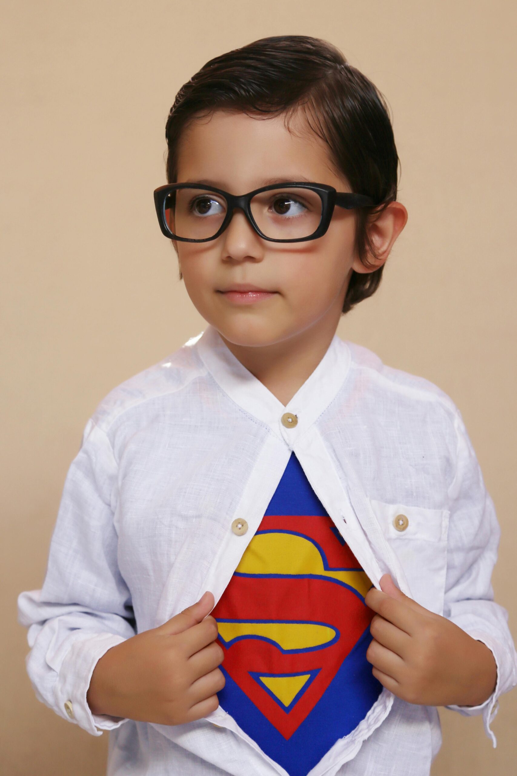 Image of young boy with a superhero shirt on.