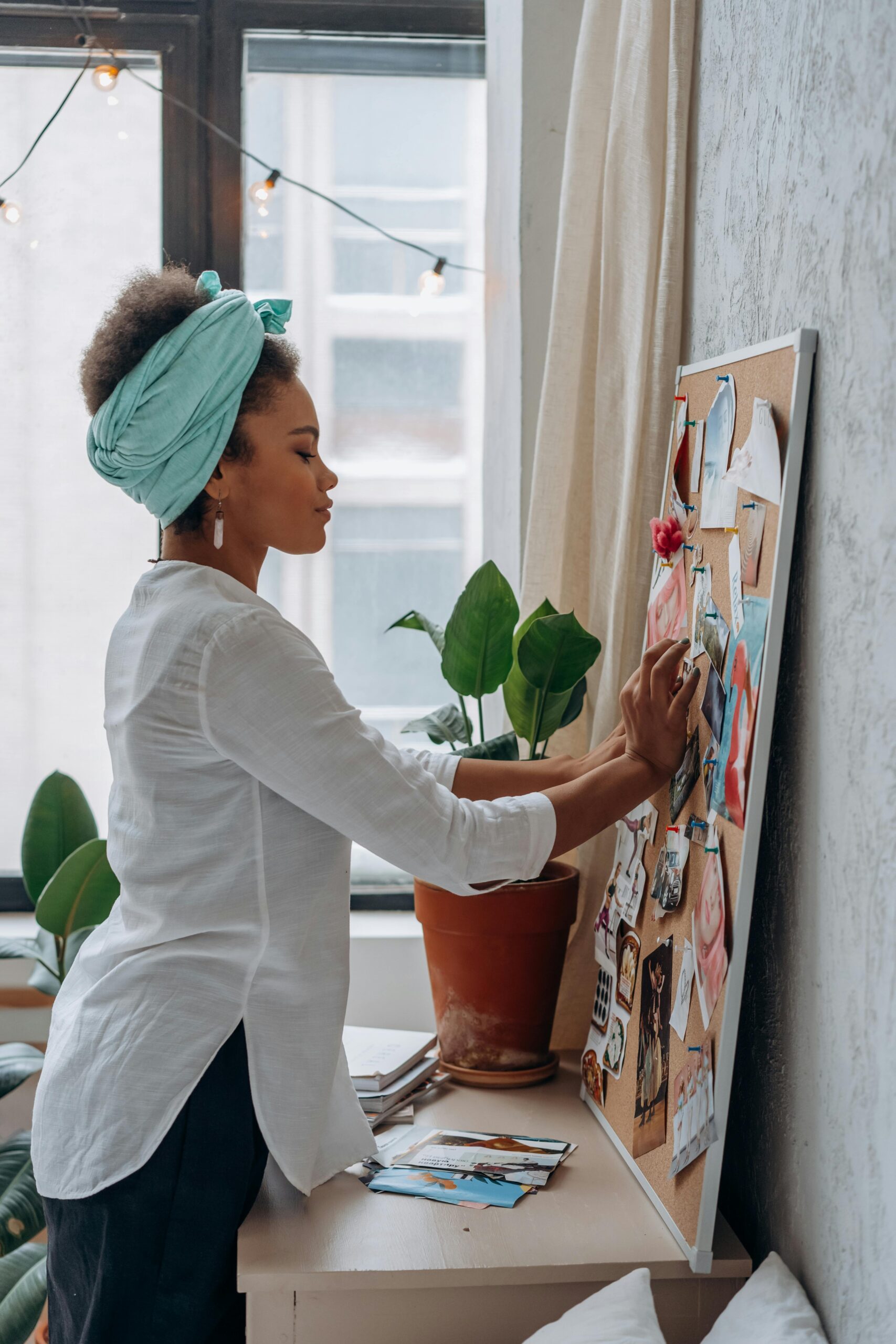 Image of young adolescent teen working in therapy on a vision board.