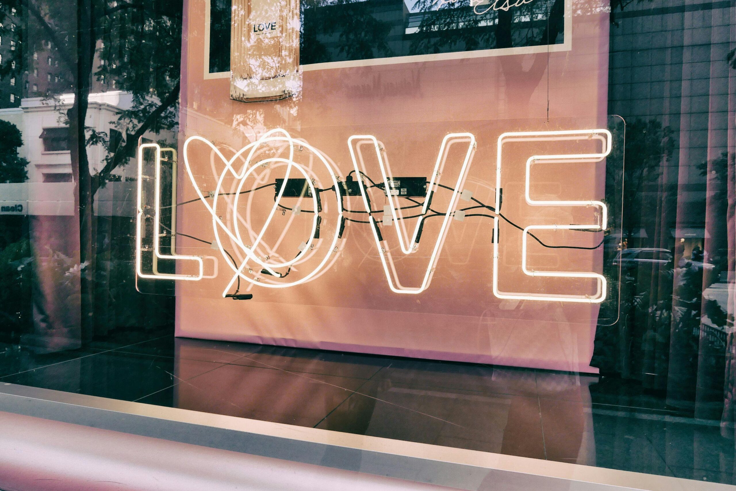 Image of the word, "love" in fluorescent lights.