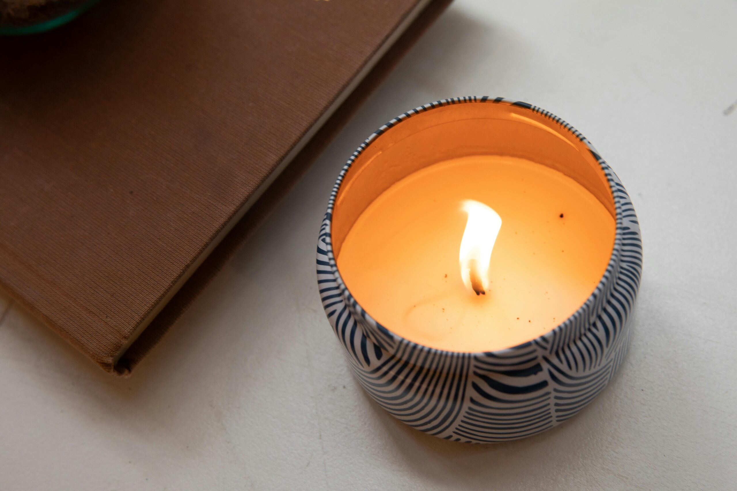 Image with lit candle, as a backdrop to the words, "Training Institute."