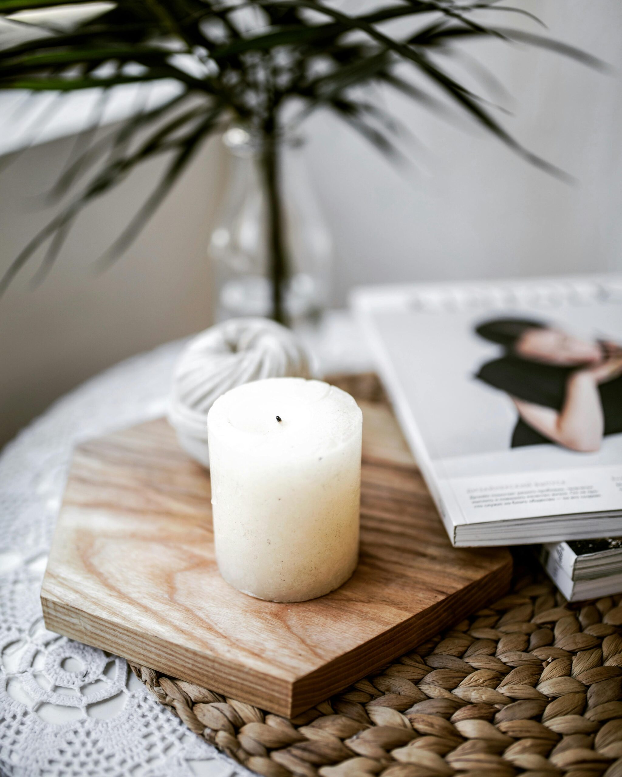 Image of a candle on a coffee table with large coffee table books, as a backdrop to the words, "Performance Therapy."